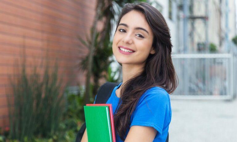 girl holding textbooks