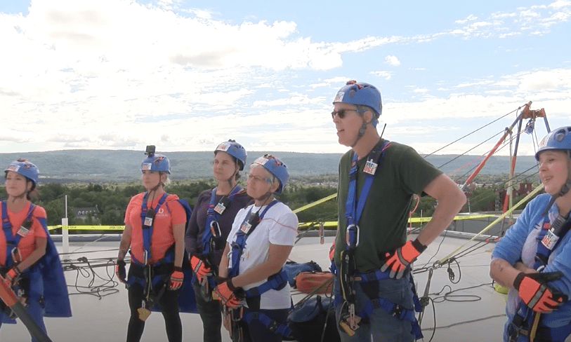 image of group preparing to rappel from building