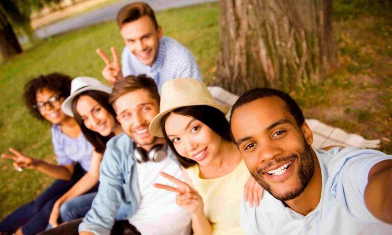group of diverse college students taking a selfie