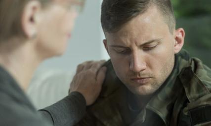 psychologist comforting soldier