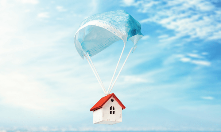 Image of house with a surgical mask acting as a parachute
