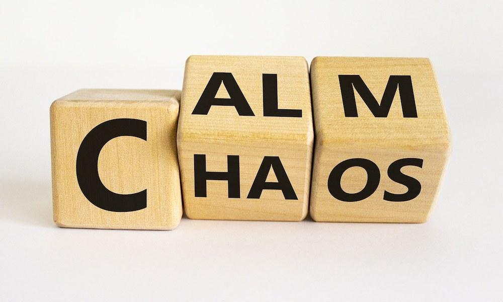 wooden blocks spelling out calm and chaos