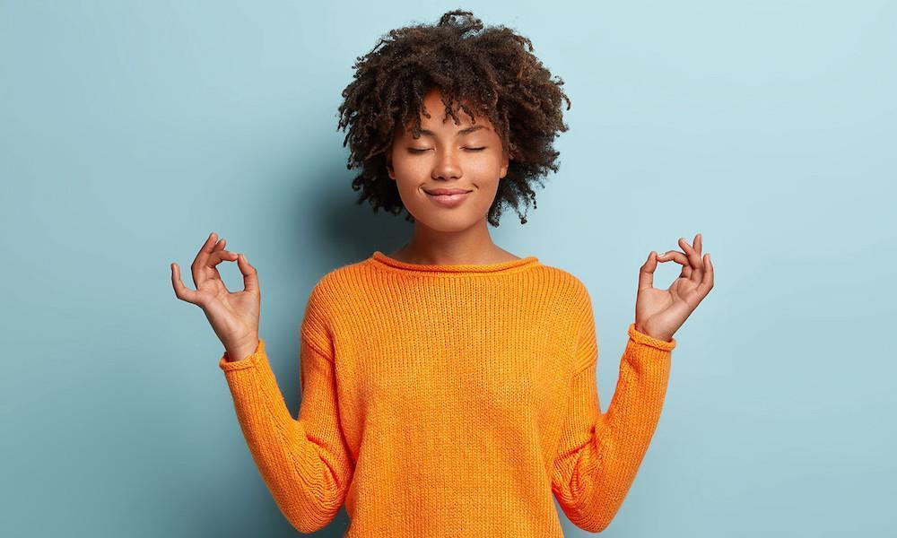smiling teen in standing meditation pose