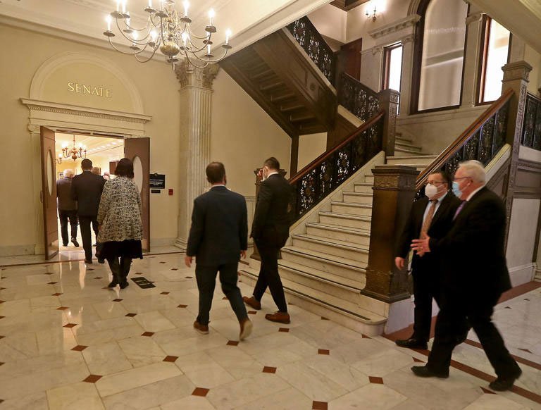 photo of legislators walking down a hallway together